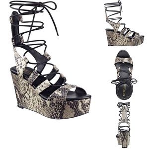 DENAYA PYTHON-PRINT FLATFORM SANDALS